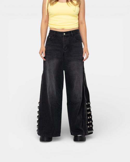 Pransh's Eden High-Rise Jeans in black featuring premium denim, featuring side zippers for a versatile flare to straight look, and premium silver hardware for versatile styling.