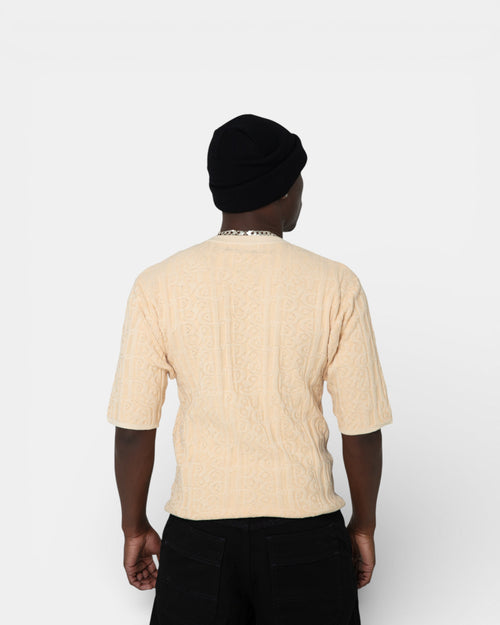 Pransh The Jacq-ed Tee in Beige, men’s 3D jacquard knit premium cotton t-shirt with all-over logo pattern, back view on model