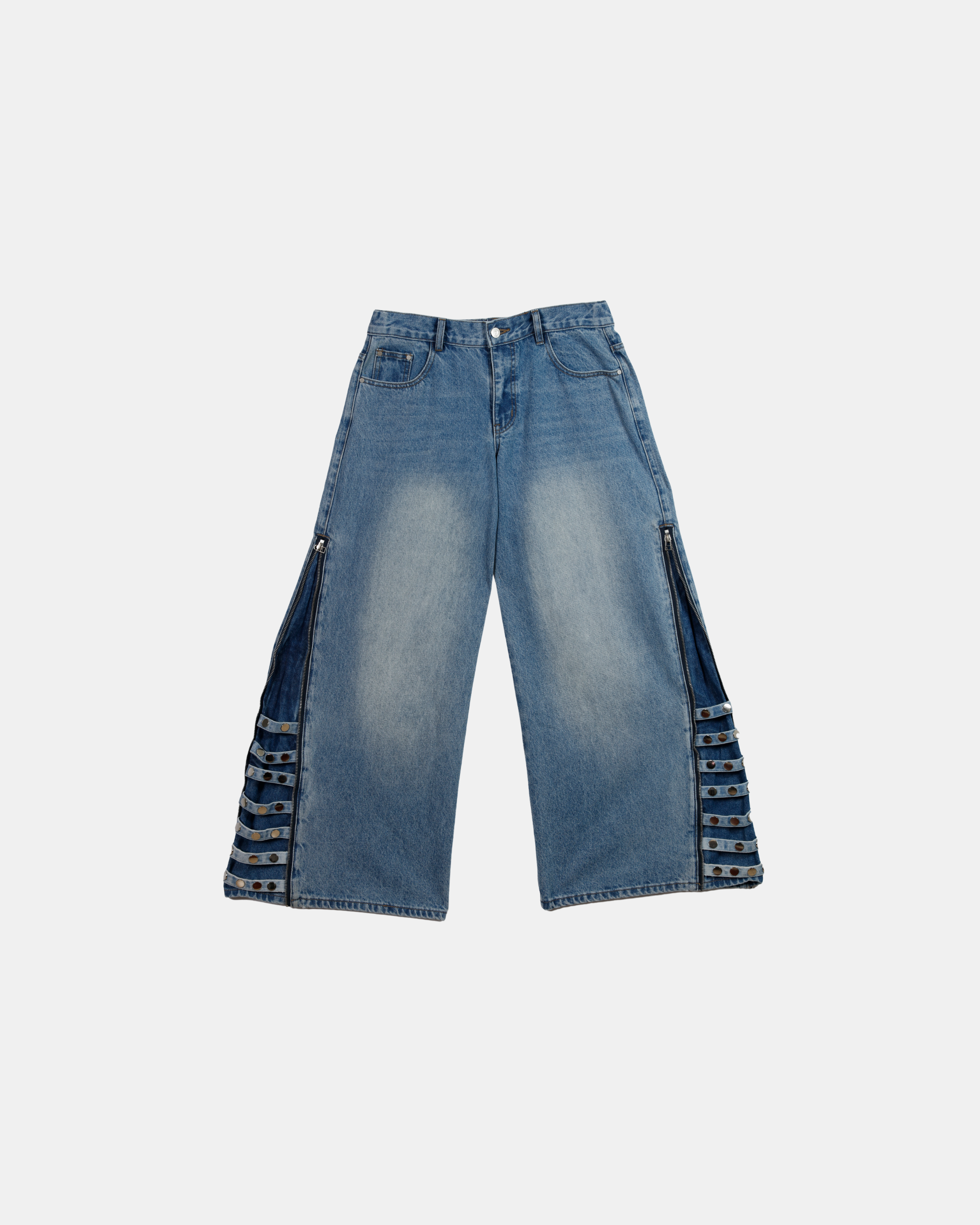 Blue jeans with decorative elements on a white background