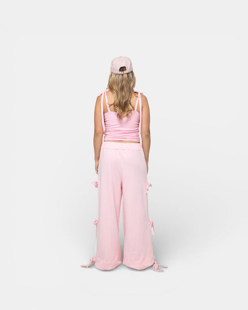 Pransh Muse Cinch Top in pink, women’s cropped stretch jersey top with adjustable tie straps, back view